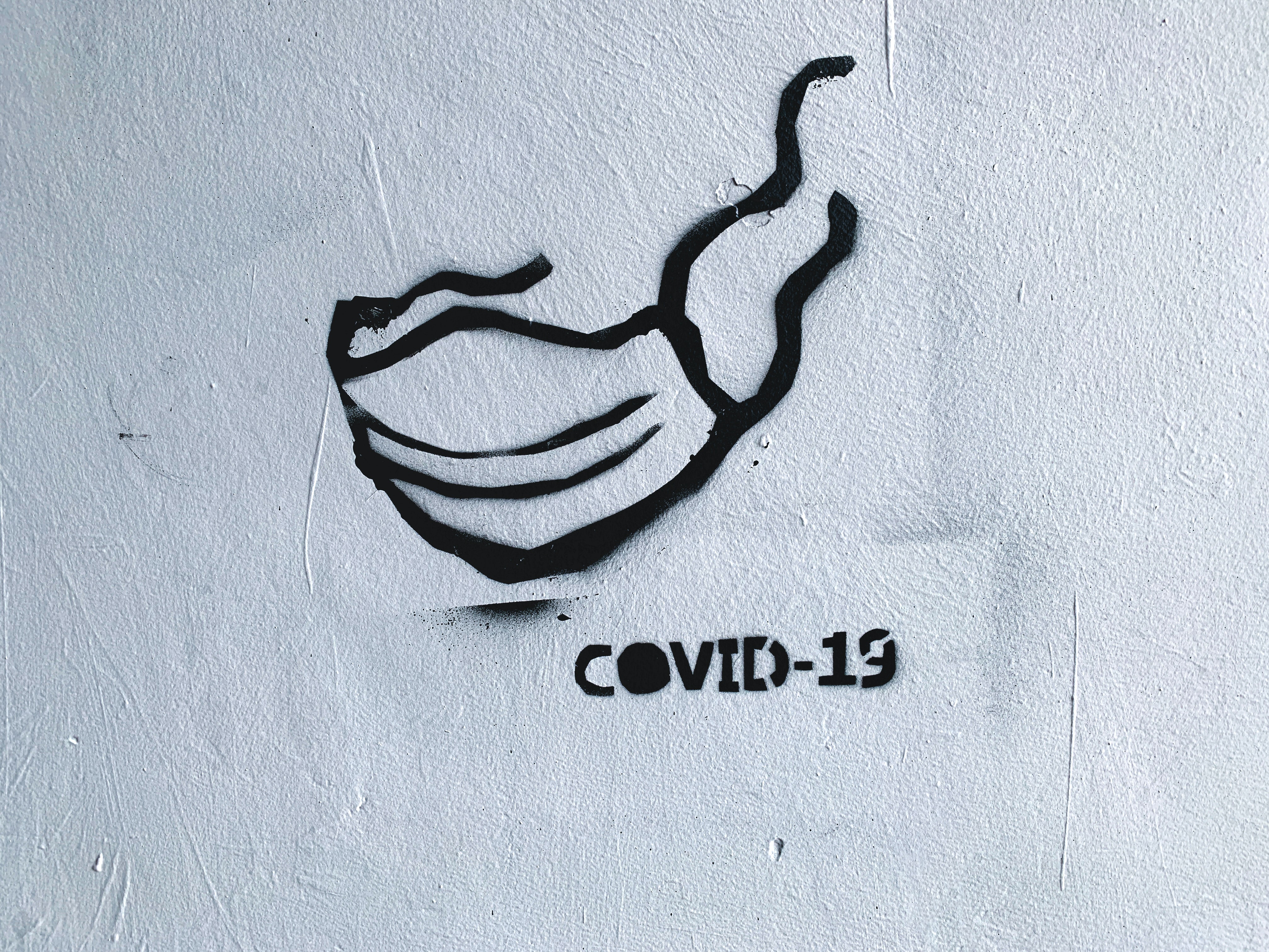 graffiti of mask with word covid-19